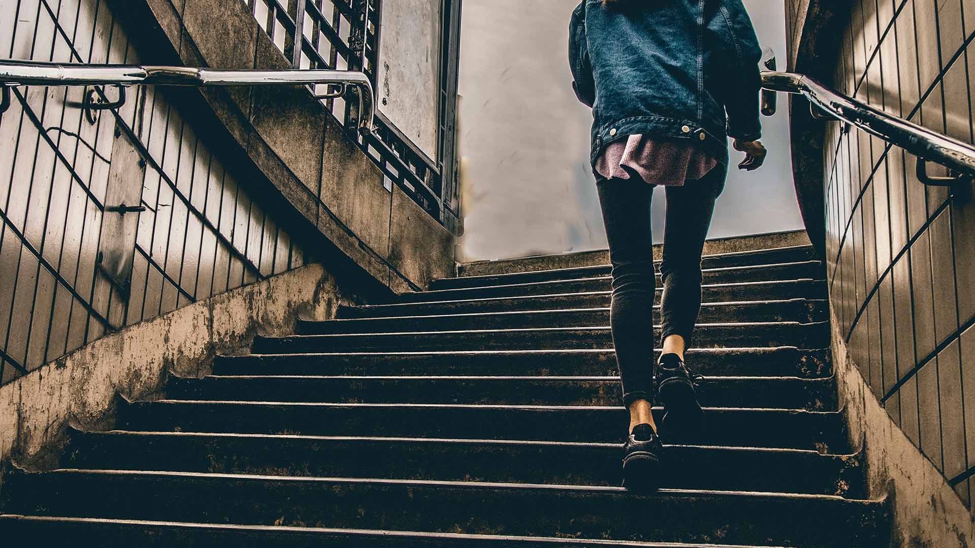 Woman walking up stairs
